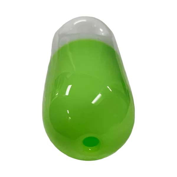 Green, transparent plastic pill with white cap on transparent cylindrical base.