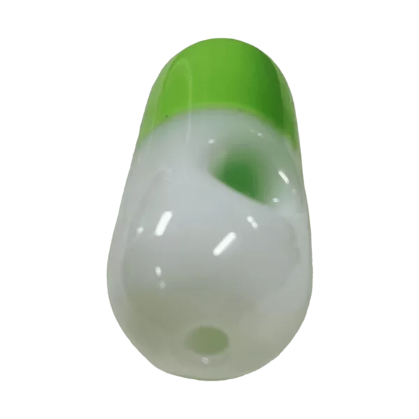 Empty clear plastic bottle with green and white striped label, small hole on top, on green background.