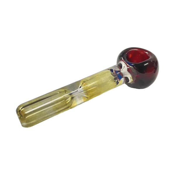 glass pipe with red and yellow stripes, a clear tube, and a skull and crossbones bowl. It has a smooth surface and is lit from the side.