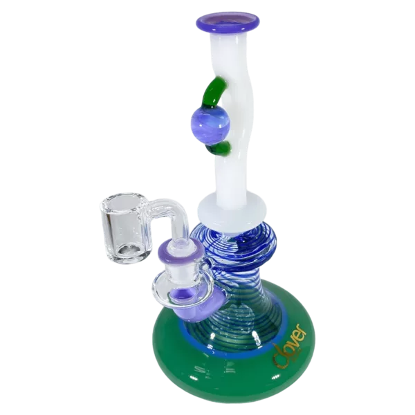 Clear glass bong with blue and green stem and small, round base. Long, curved neck with small, round hole at bottom. Sits on small, round base with hole at top. Unique, artistic design.