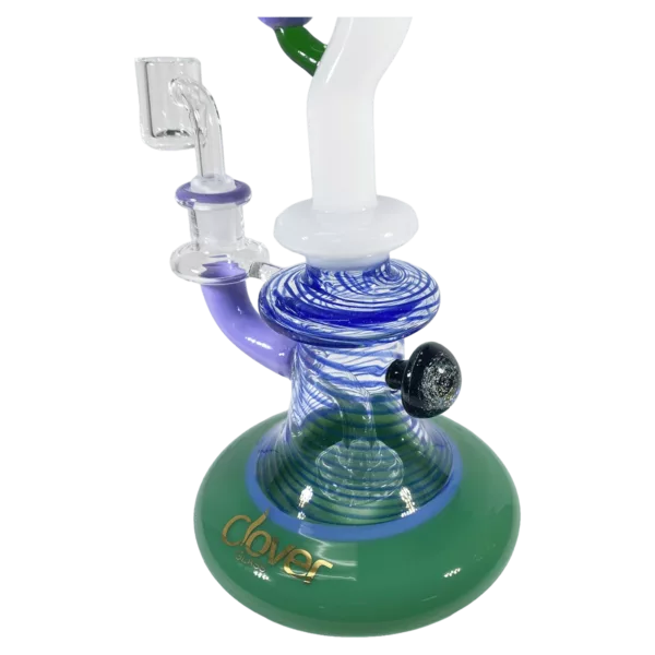 glass water pipe with a clear stem and blue/green body featuring intricate wave, swirl, and star patterns.