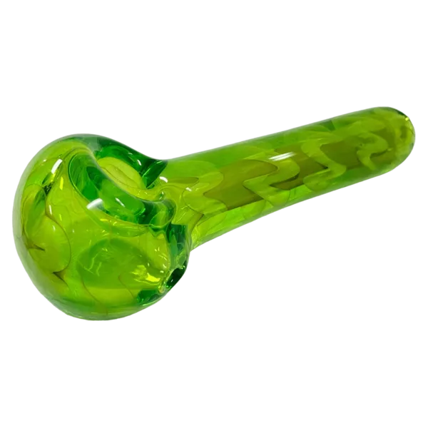 irregularly shaped, small bowl, curved handle with indentation, sits on green background.