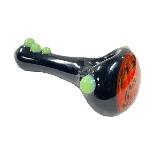 Multiverse Glass Black Wigwag Spoon with green, yellow, and orange spiral design on black handle.