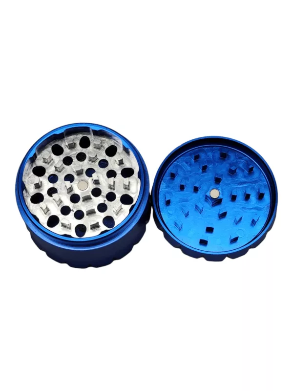 Metal grinder with blue circular shape and small hole. Smooth surface, BVGA092 model. Designed for grinding herbs and other materials.