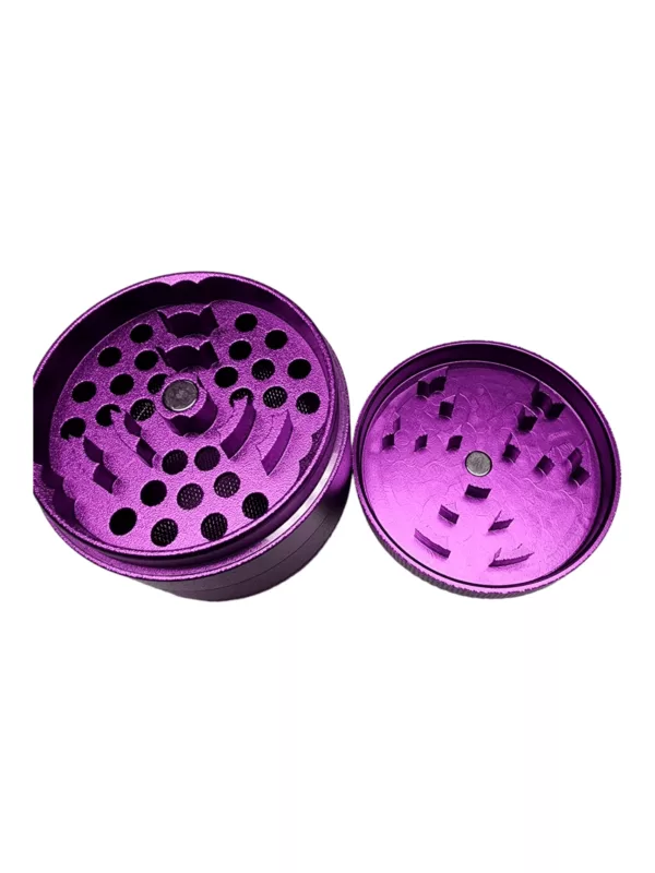 Metal base and plastic lid grinder in purple color with two circular openings and small holes on lid and base.
