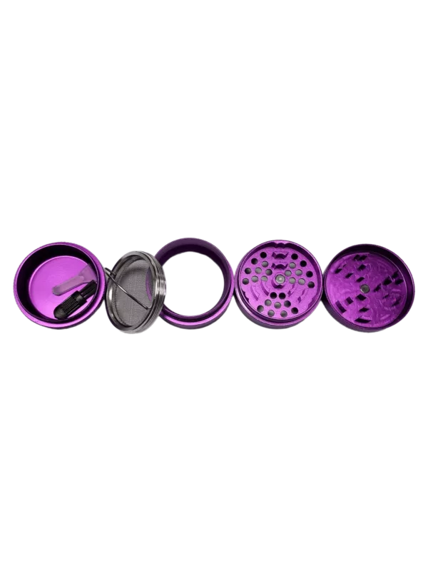 Two circular grinders, one silver with a small white center and one purple with a larger silver center, designed for grinding dry herbs and materials.