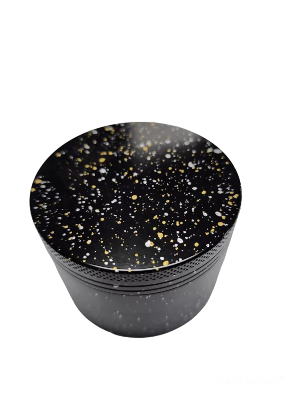 Elegant and luxurious black and gold glittery grinder with a shiny metallic surface and raised gold rim.