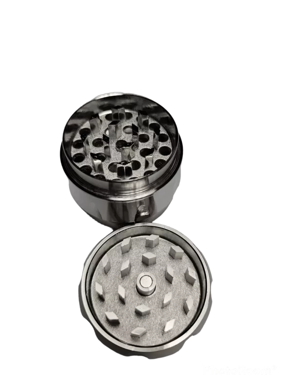 Stainless steel grinder with 3 chambers, single top hole, polished finish, and screw-on top. Designed for use with bolt and nut. Black and white design.
