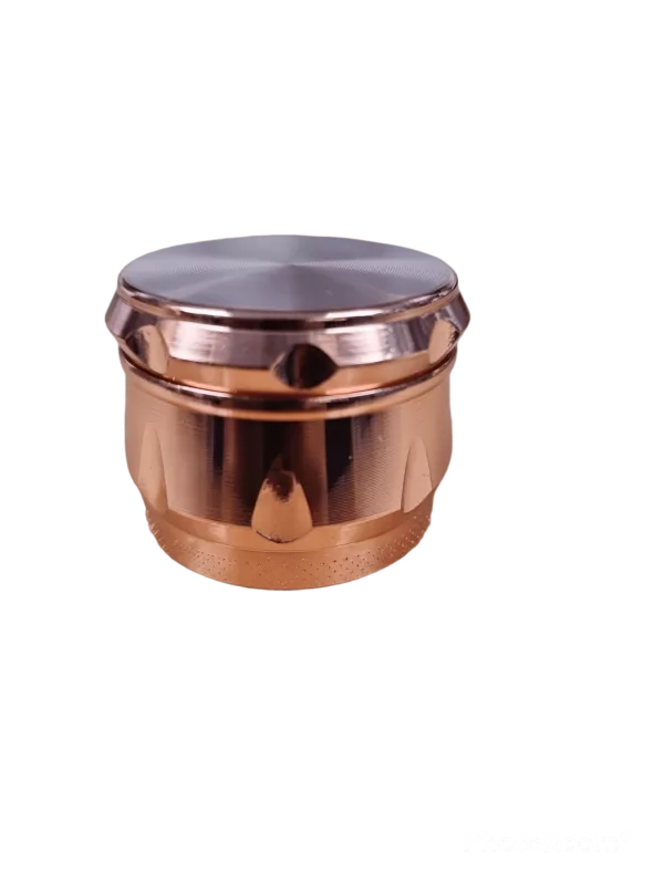 Copper Crome 3 Chamber Grinder - BVGS12043: Round, smooth copper grinder with flat bottom. Sat on green background.