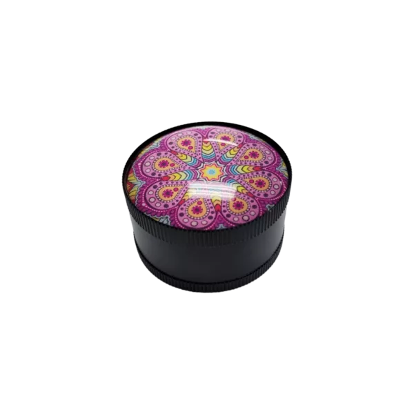 Psychedelic White Girl Grinder - BVGS110: Round, black container with colorful, swirling pattern in shades of pink, purple, and orange. Flat, smooth surface with small circular handle made of same material and small knob on top. Symmetrical design with no visible text or other elements.