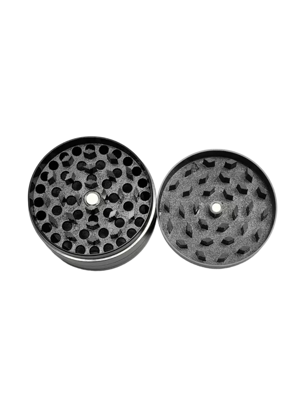 Pair of metal grinders with black finish, one with small hole, one with larger hole. Designed for use with grinder attachment for fine powder.