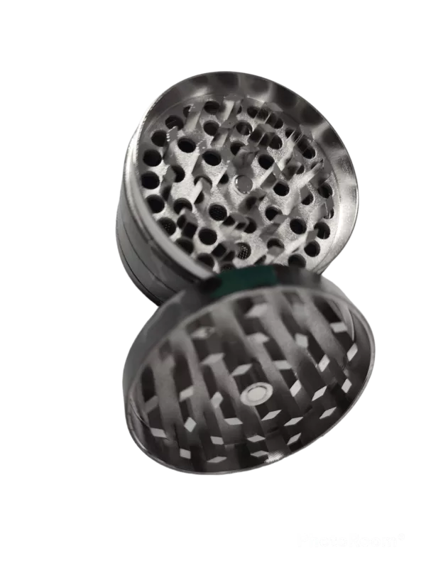 Stainless steel grinder with circular shape, multiple holes, and matte finish. Compact, durable, easy to use and clean.