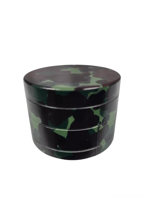 Hexagonal grinder with black and green camouflage print. Square handle with black knob. No visible buttons or other controls. Green hexagon base with black printing.