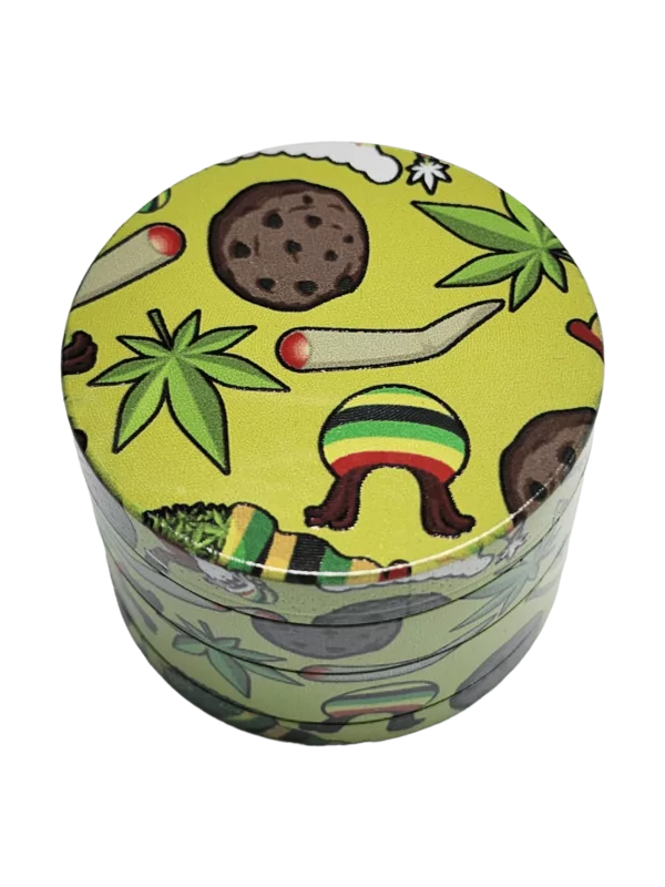 Green and brown cannabis leaf patterned grinder for smoking accessories, ideal for grinding herbs.