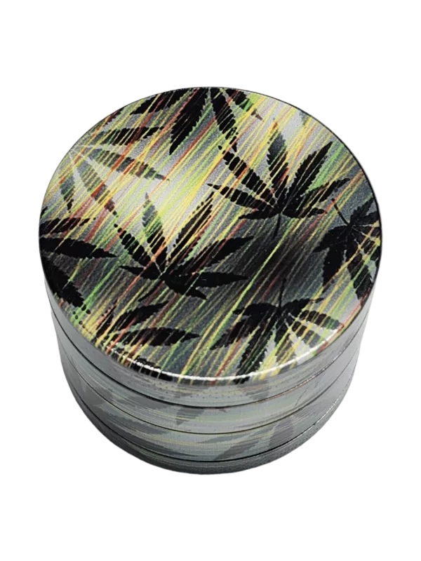 Round metal container with green & yellow leaf design, smooth surface, and green background.