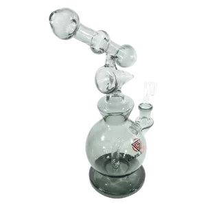 Glass water pipe with clear stem, large cylindrical base, circular handle and hole on side and bottom. Decorative circular hole and handle on base.