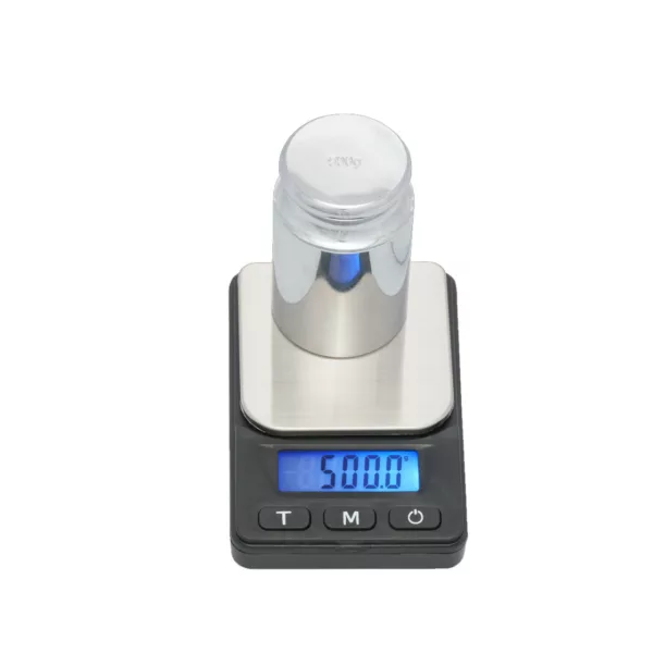 precision electronic scale with a maximum capacity of 100 grams and a minimum capacity of 0.1 grams. It has a black frame with silver numbers and a blue button on the top, and is designed for weighing objects in laboratory or kitchen settings.