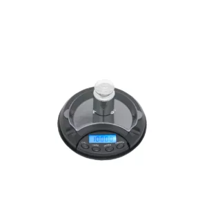 Digital scale with white display screen on top of white surface.