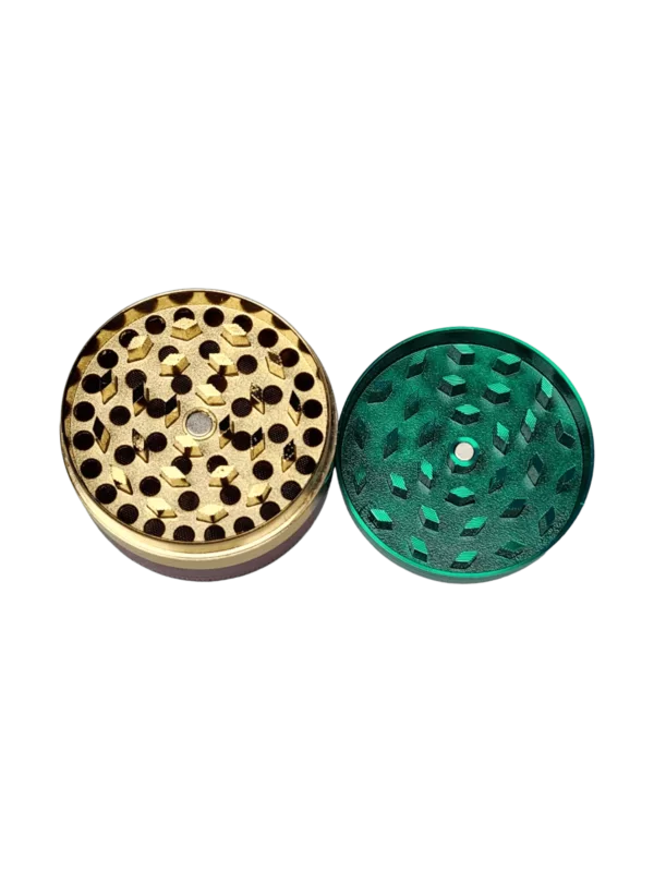 brass/copper grinder with a star pattern and intricate details.