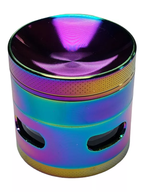 Handcrafted multicolored glass grinder with concave side window and intricate metal handle. High-res image on white background.