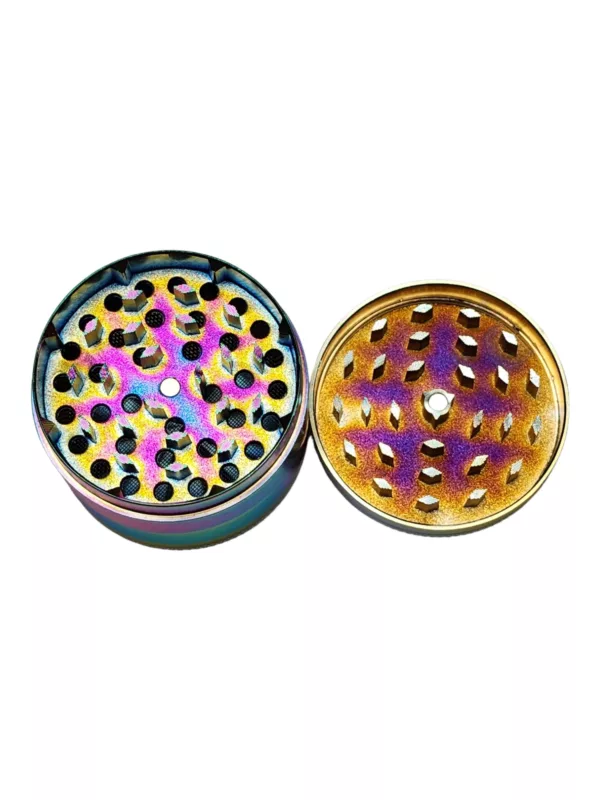 Glossy, circular metal herb grinder with unique black, blue, and green pattern. Polished brass or copper construction. Great addition to any kitchen or home.