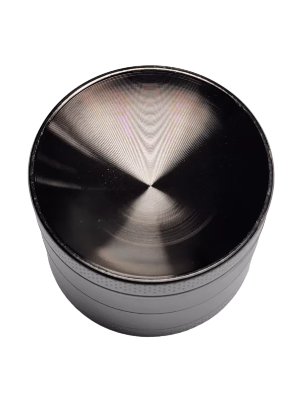 A sleek, round metal grinder with a smooth surface and circular handle for grinding herbs.