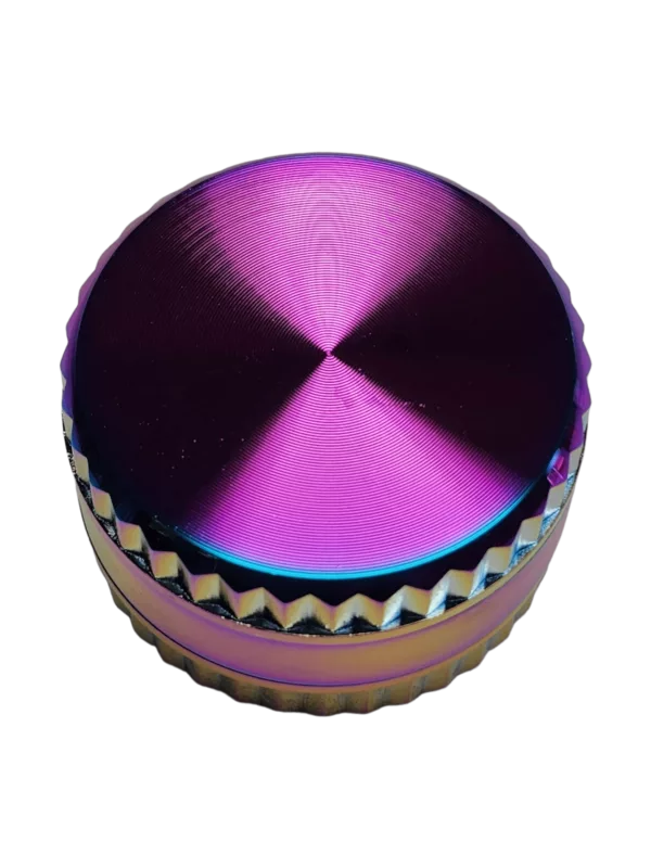 A colorful, shiny metal grinder with a holographic top and a flat bottom.