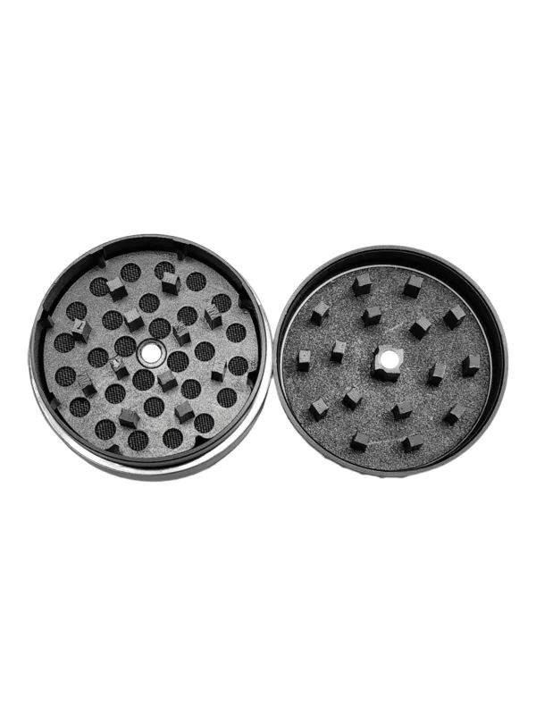 Black and silver grinder with lid and small holes on top and bottom for smoking.