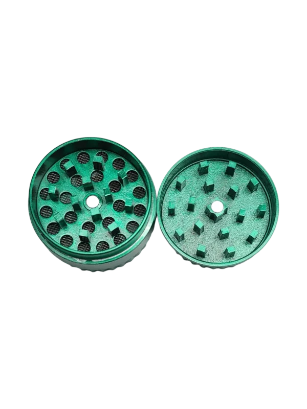 Green plastic circular herb grinder with small center hole for easy access and use with power source.