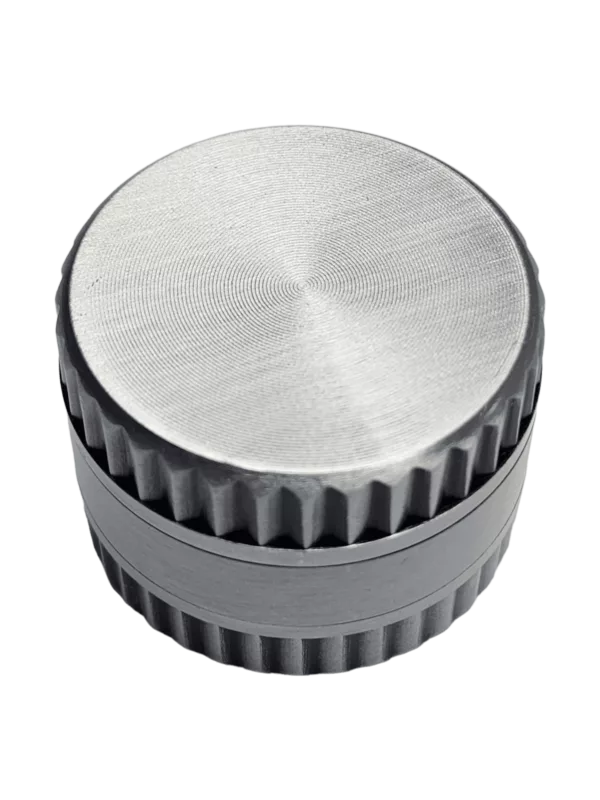 Stainless steel grinder with 3 tiers and a grooved center for efficient tobacco or herb grinding.