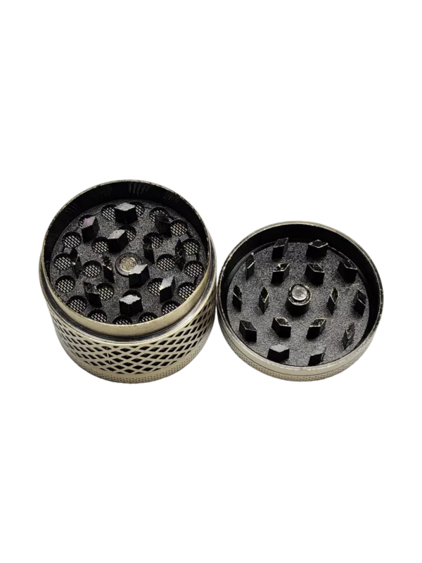Handcrafted brass/copper cross pattern grinder with 2 discs, different hole sizes, and a round base. Perfect for herb grinding.