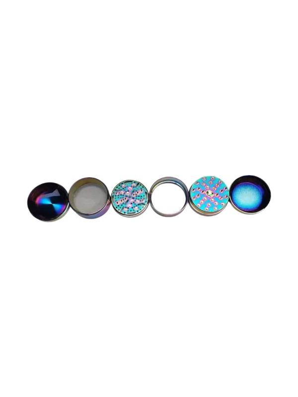Six colorful, circular glass pieces suspended in mid-air on a black background.