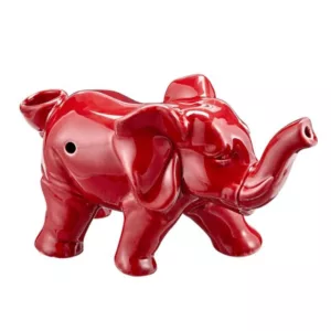 Red ceramic elephant-shaped pipe with round body, long trunk, and raised trunk, standing on hind legs. White background.