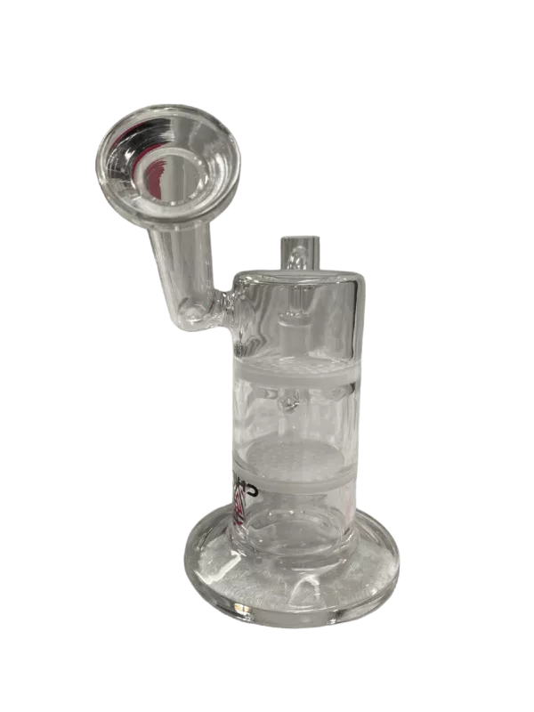 Clear glass bong with cylindrical shape and small circular base. Sitting on stand with small circular base.