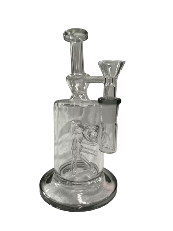 A V6 Rig with a long stem, small chamber filled with water, and a black base with drip tray. The base has a small hole where water drips from the chamber.