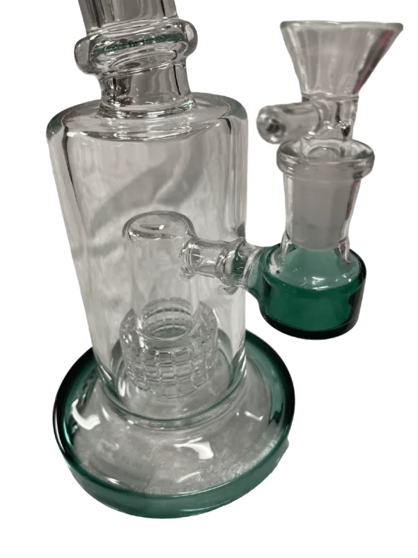 Glass water pipe with blue base and green writing 'Straight Matrix Revolution - BVWB5'. Blue ring around base, no other features visible.