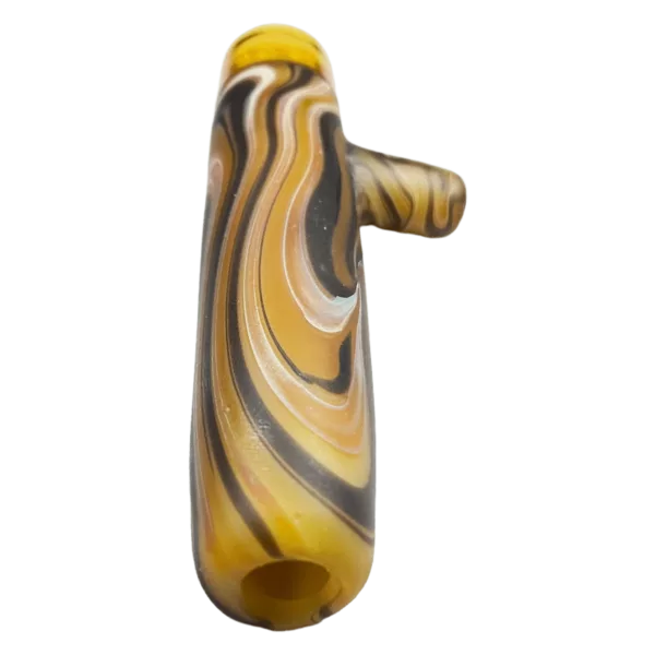 This Woodgrain Tech Compression Chillum - Hion/Dekal Glass pipe features a yellow and black swirled glass design with a small hole at the end, sitting on a green background.