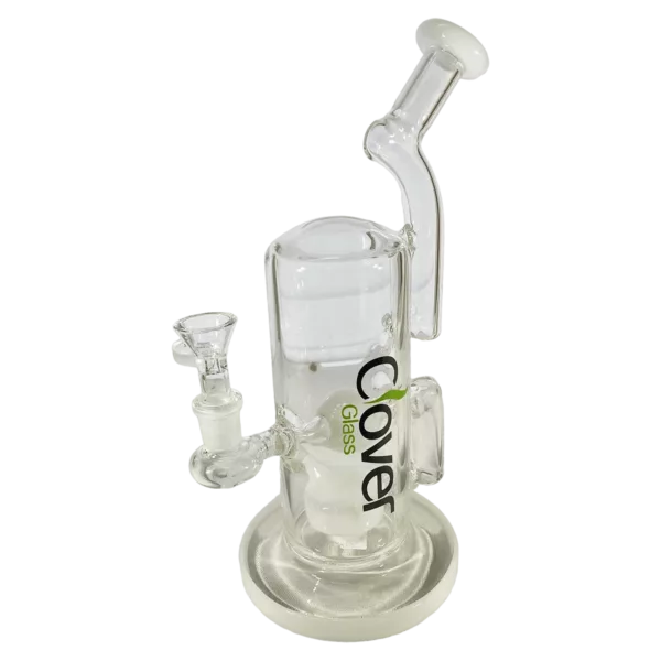The image shows a clear glass bong with a white base and a clear stem. It has a small, round base and a long, curved stem. The stem is attached to the base with a small, clear joint. It is sitting on a white, round base with a small, clear stem.