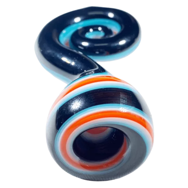 Glass pipe with blue, orange, and white stripes on a green surface.
