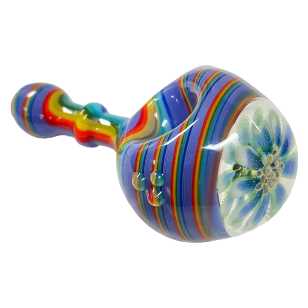 Colorful striped glass pipe with round shape and small hole for smoking. Made of clear glass and sits on white background.