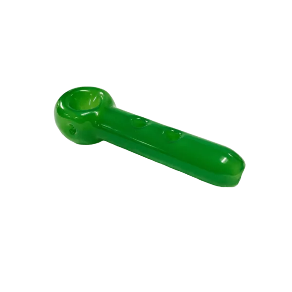 Green plastic cigar-shaped pipe with small hole at end, sitting on green background.