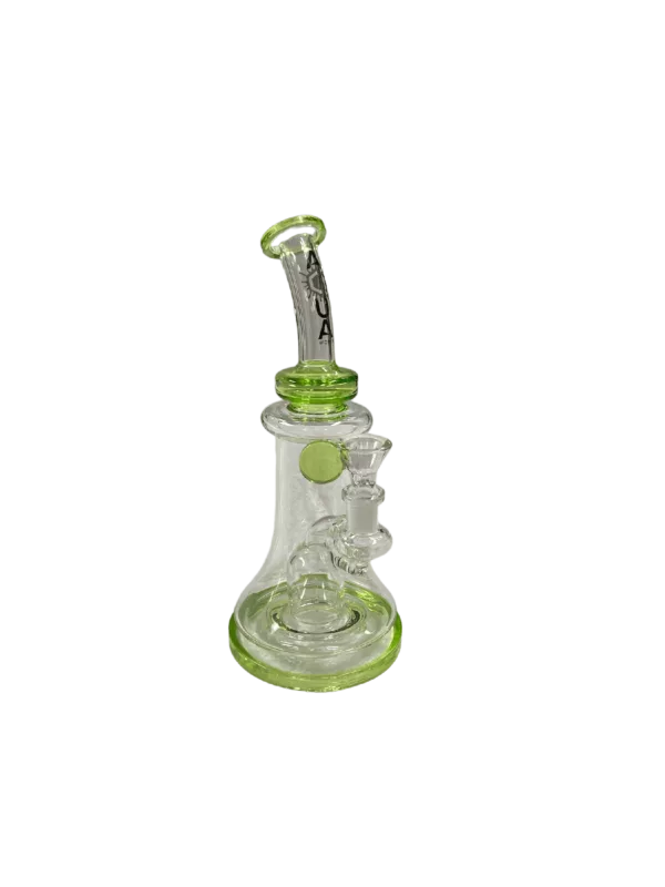 glass bong with a clear stem and green base. It has a small, round base and a long, curved neck. The bong is sitting on a green surface.