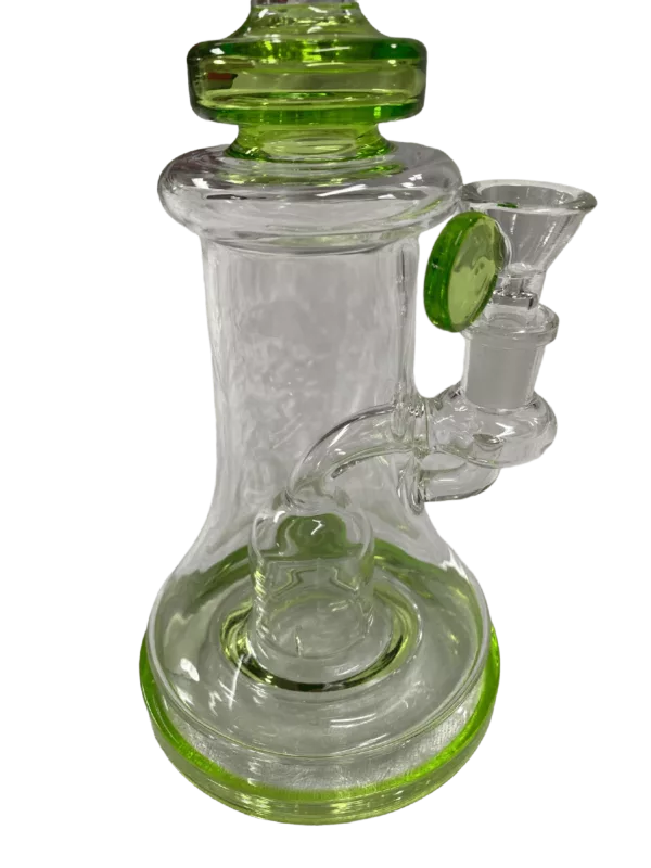 Green-stemmed glass bong with clear base and small hole at top. Curved neck and round base. From Aqua Works.