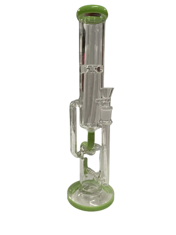 The Side Tube Recycler Water Pipe has a sleek and modern design with a clear stem, green base, and two bowls connected by a stem. It sits on a small pedestal.