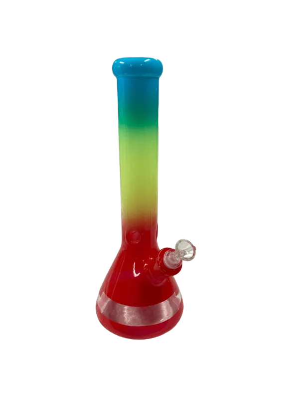 Rainbow colored glass bong with clear base and stem, sitting on green background.