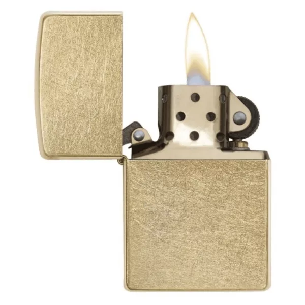 The Regular Gold Dust Zippo lighter has a rectangular shape with a gold metal frame and a small rectangular opening on the front. It is open, showing the flame inside, and is on a white background.