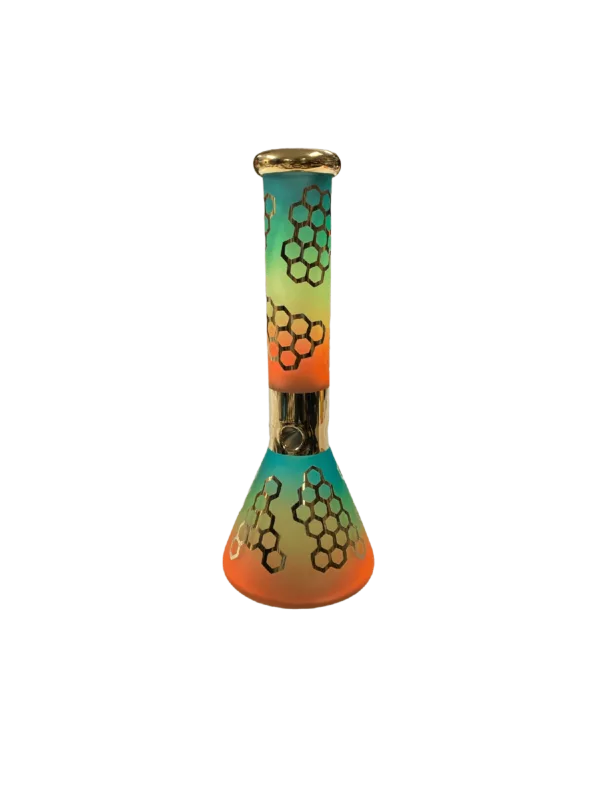 Clear glass pipe with gold band and honeycomb pattern in shades of orange, yellow, and green. Minimalist and modern design.