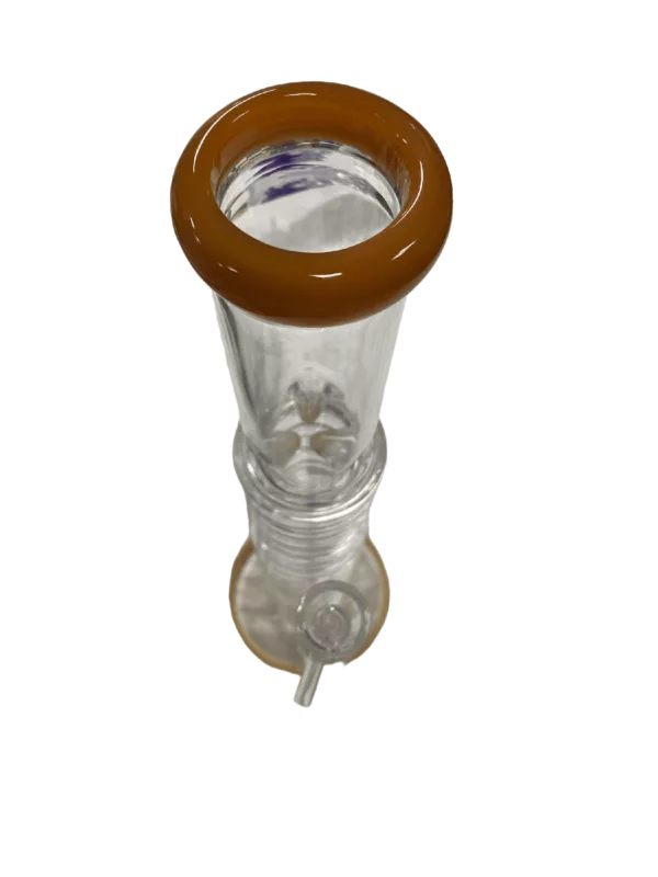 Glass beaker with brown handle and clear glass body. Small opening at top, larger opening at bottom. Handle has small knob on end. Sits on white background.