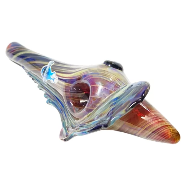 A glass pipe with a spiral design in blue, green, and purple, sitting on a white surface.