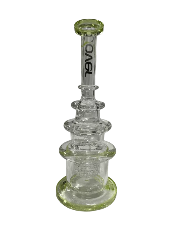 Clear glass bong with small circular mouthpiece and base, sitting on green background.